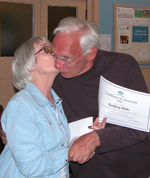 Linda presents Geoff with the AACI certificate