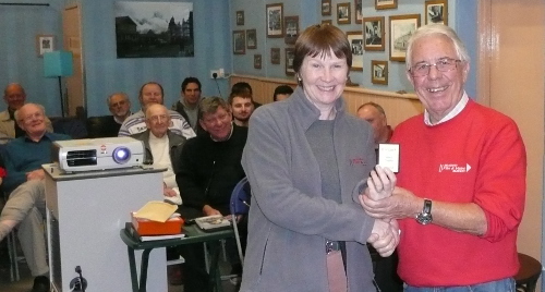 Anne receiving the Ward mini shield from Laurie