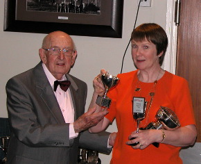 Bernard presents Anne with the Points Award cup among others