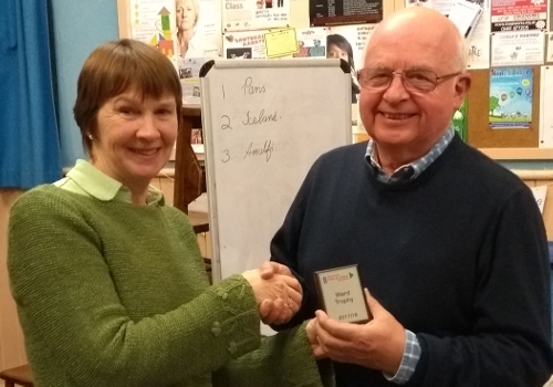 Anne receiving the Ward mini shield from Mike